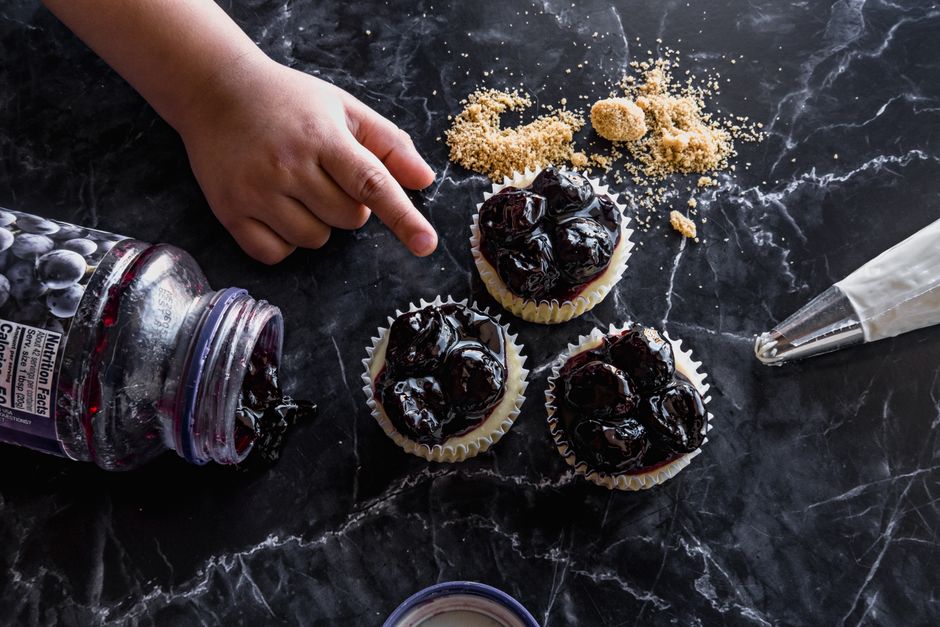 Delicious blueberry cheesecakes on marble, perfect for dessert lovers.