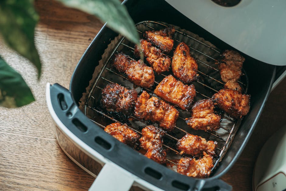 Delicious crispy chicken pieces cooked perfectly in a modern air fryer, ready to serve.